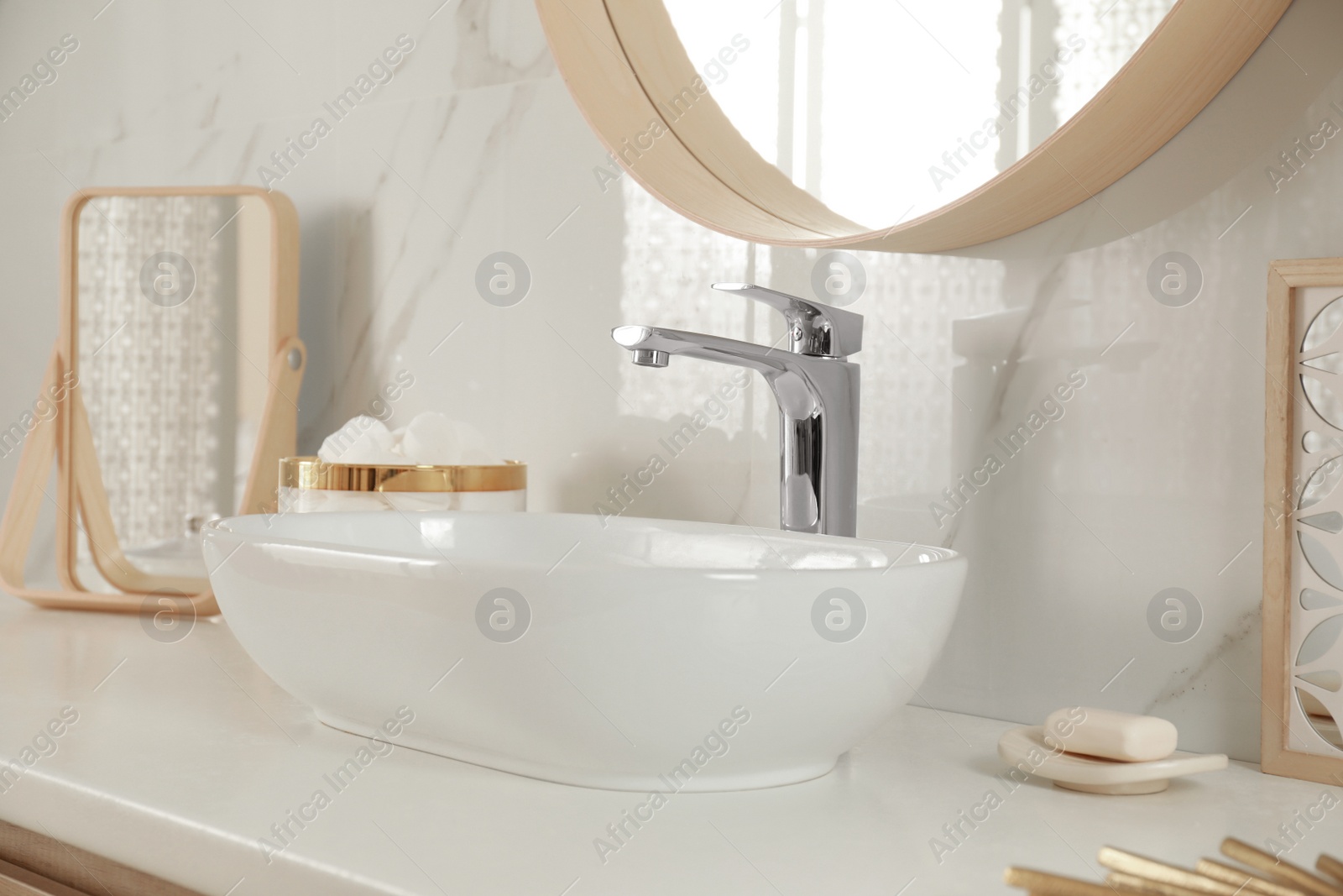 Photo of Stylish bathroom interior with vessel sink and decor elements