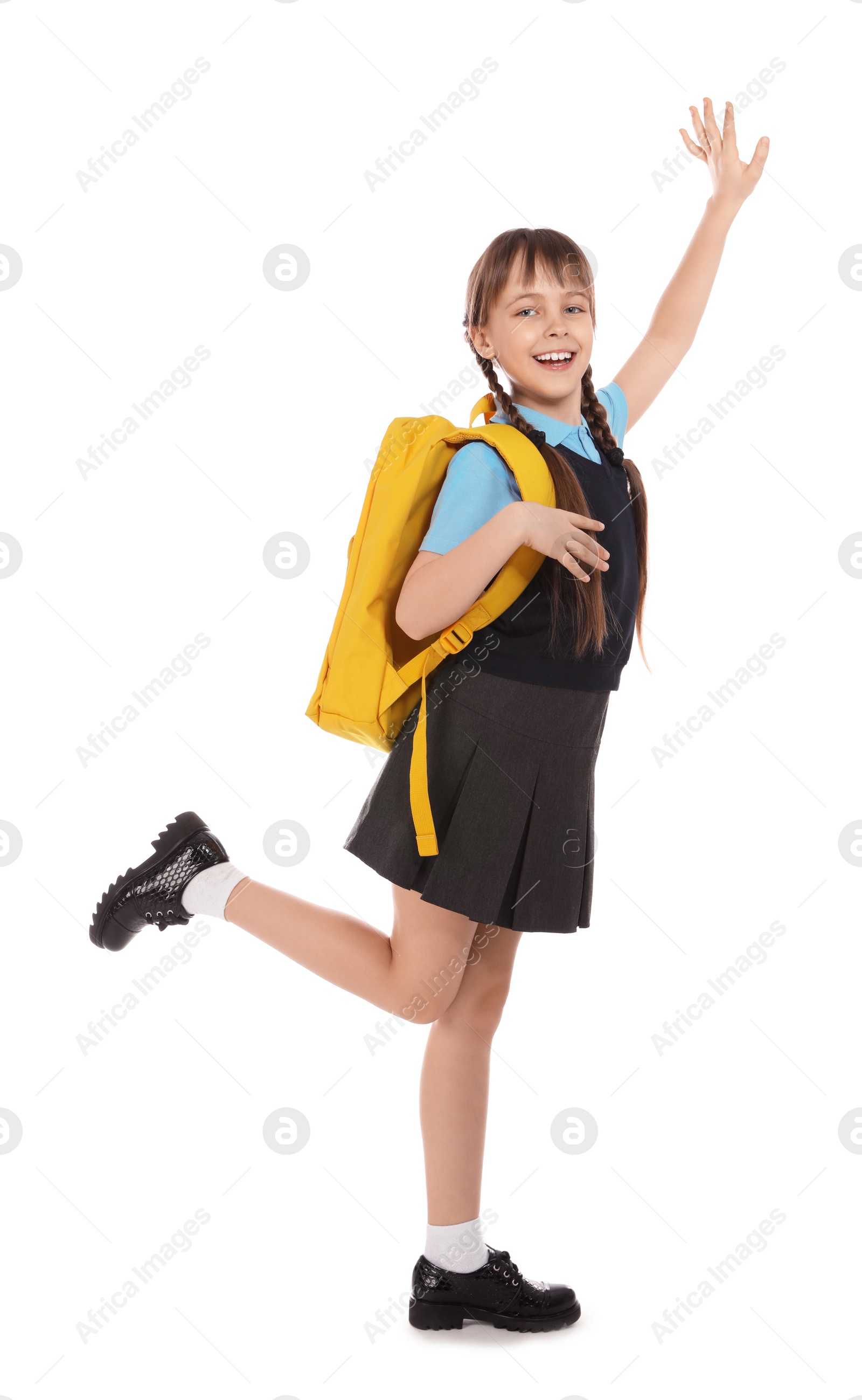 Photo of Full length portrait of cute girl in school uniform with backpack on white background