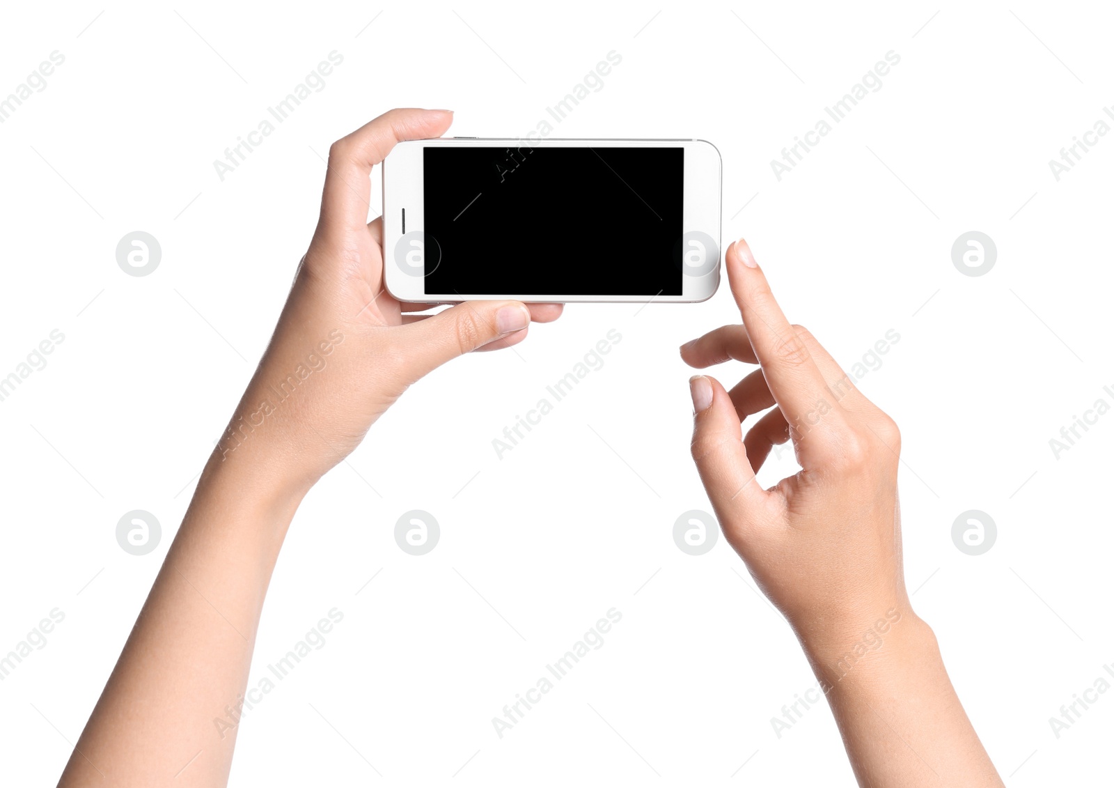 Photo of Young woman holding mobile phone with blank screen in hands on white background