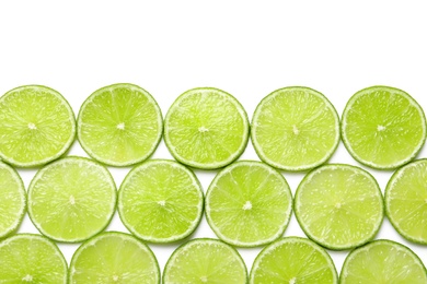 Photo of Fresh sliced ripe limes on white background, top view