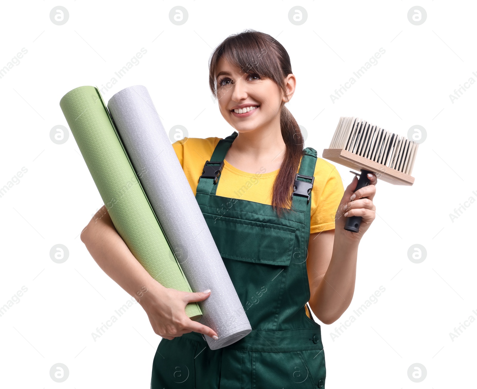 Photo of Beautiful woman with wallpaper rolls and brush on white background