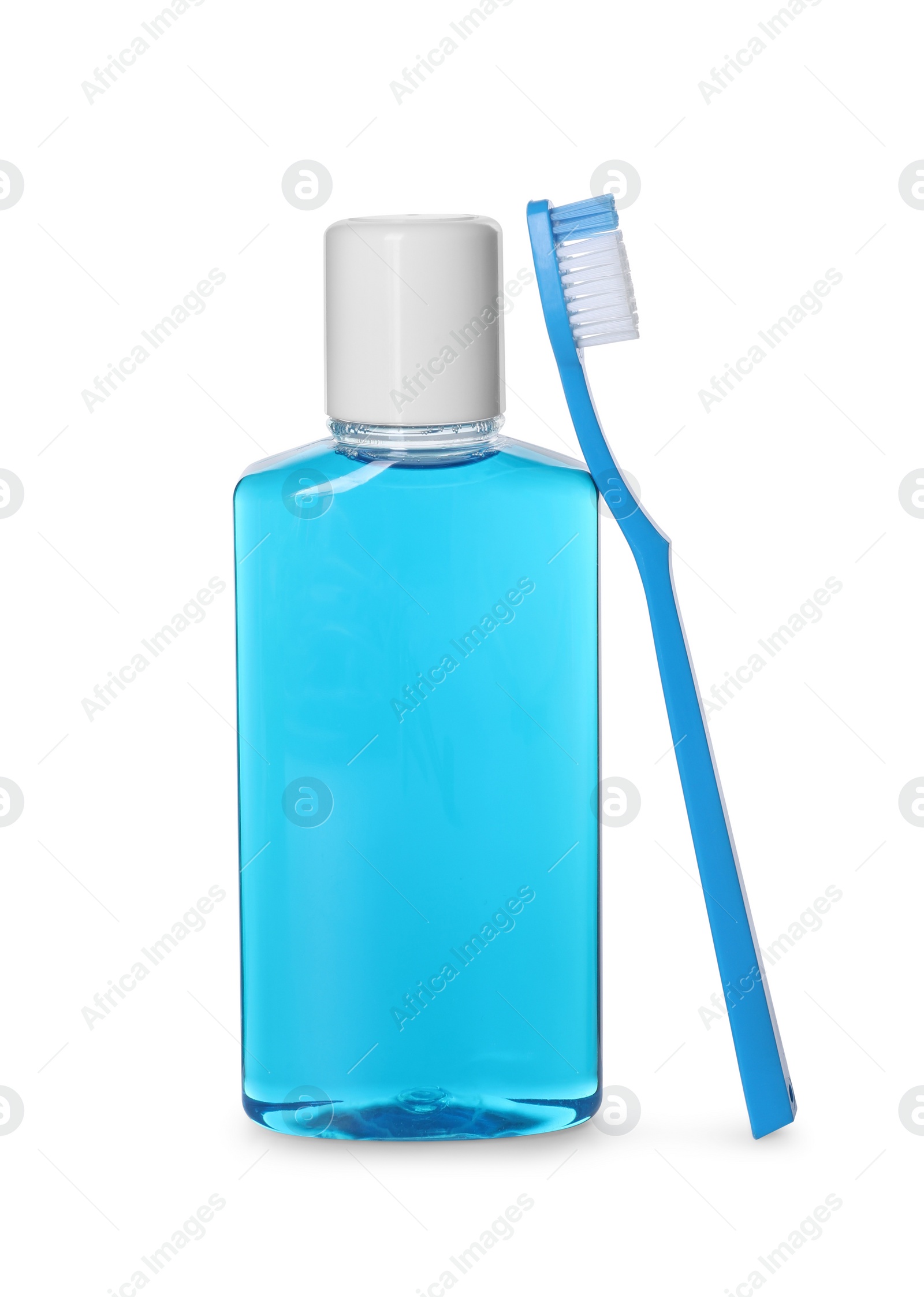 Photo of Bottle of mouthwash and toothbrush isolated on white