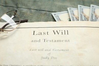 Photo of Last Will and Testament, glasses and dollar bills on rustic wooden table, closeup