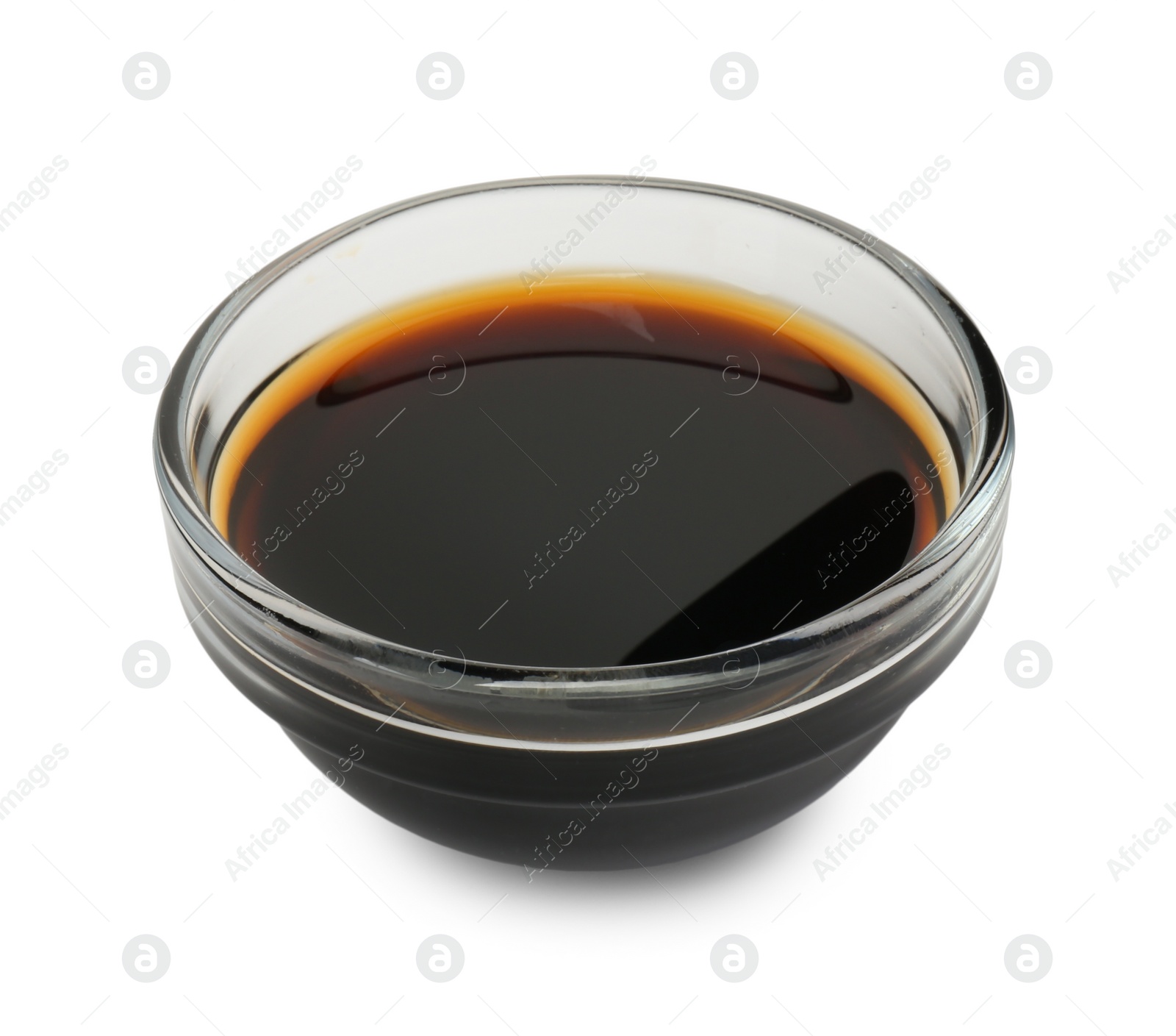 Photo of Tasty soy sauce in glass bowl isolated on white