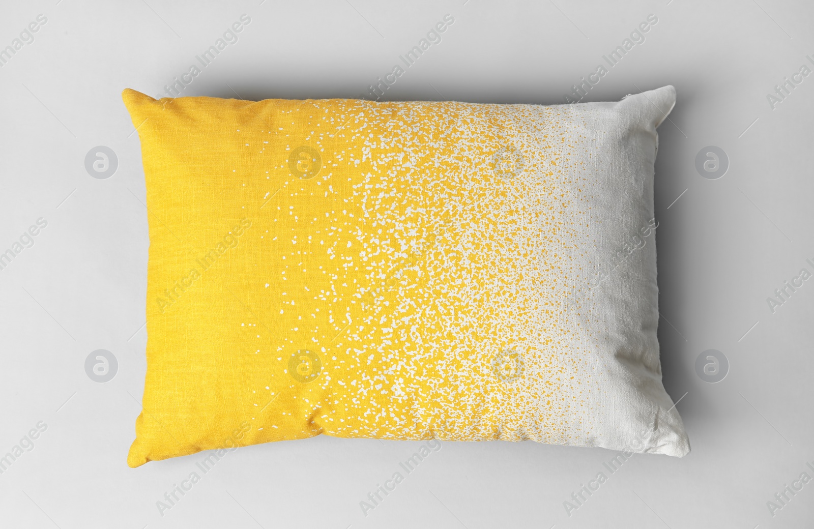 Photo of Soft decorative pillow on light background