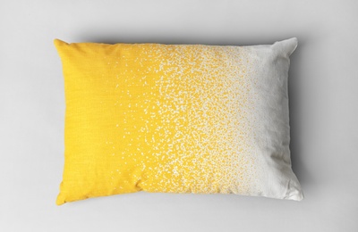 Photo of Soft decorative pillow on light background