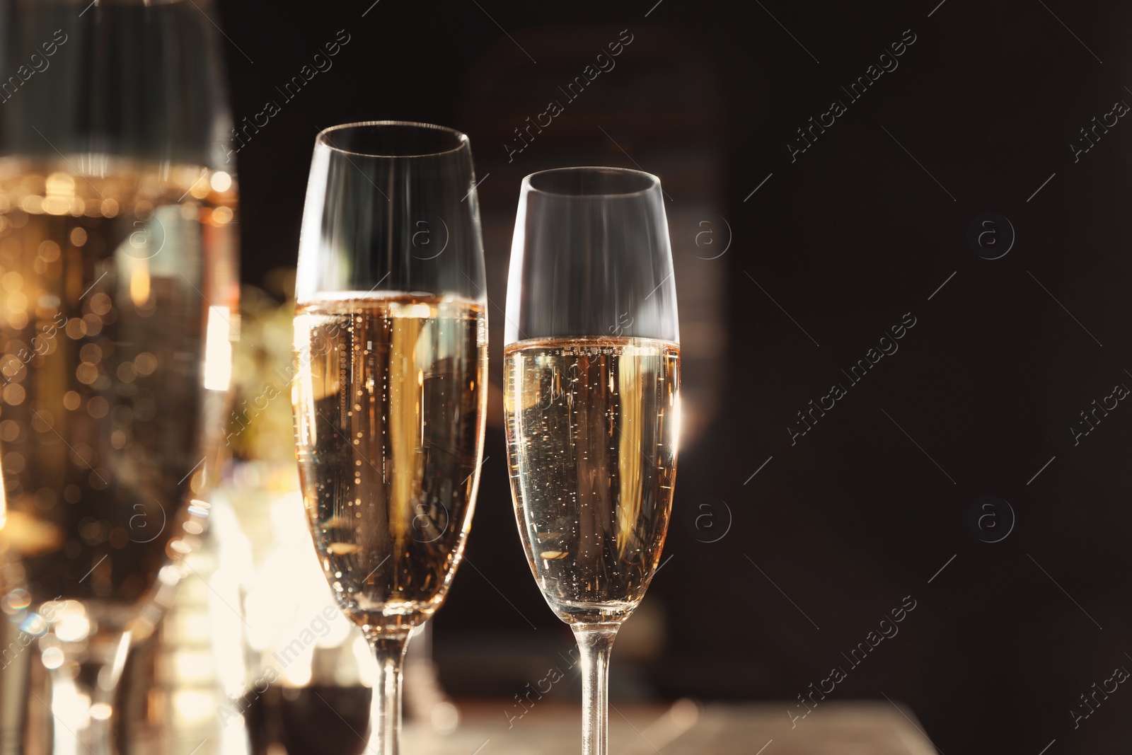 Photo of Glasses of champagne in bar. Space for text