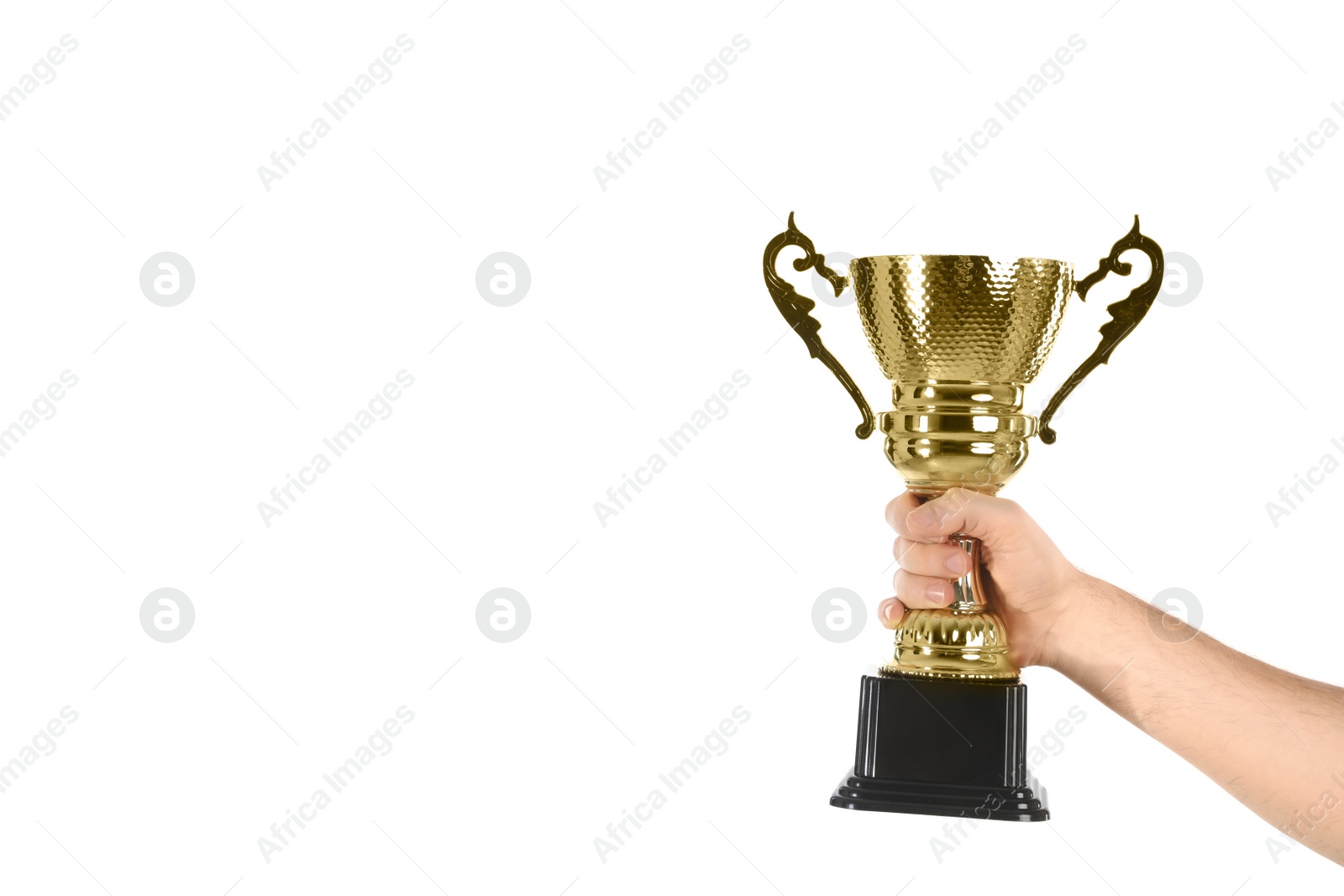 Photo of Man holding gold trophy cup on white background, closeup