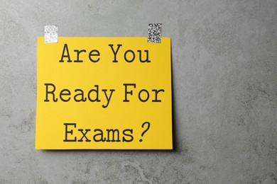 Photo of Sheet of paper with question Are You Ready For Exams? on grey table, top view