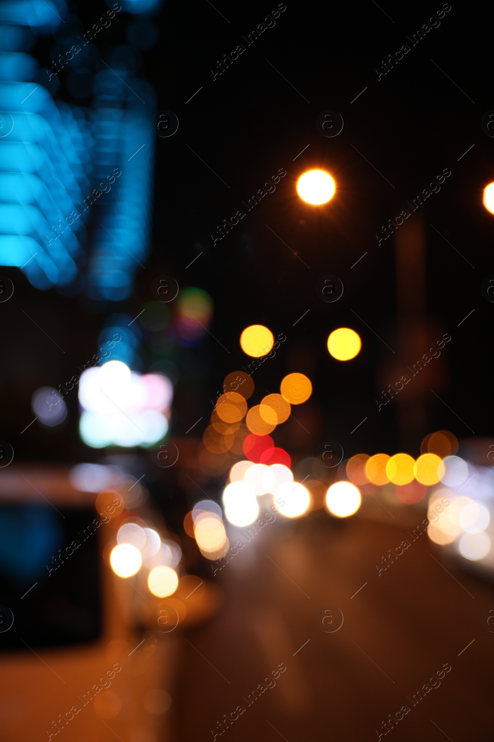 Photo of Blurred view of cityscape with bokeh effect. Night life