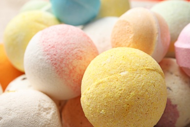 Photo of Many bath bombs as background, closeup view