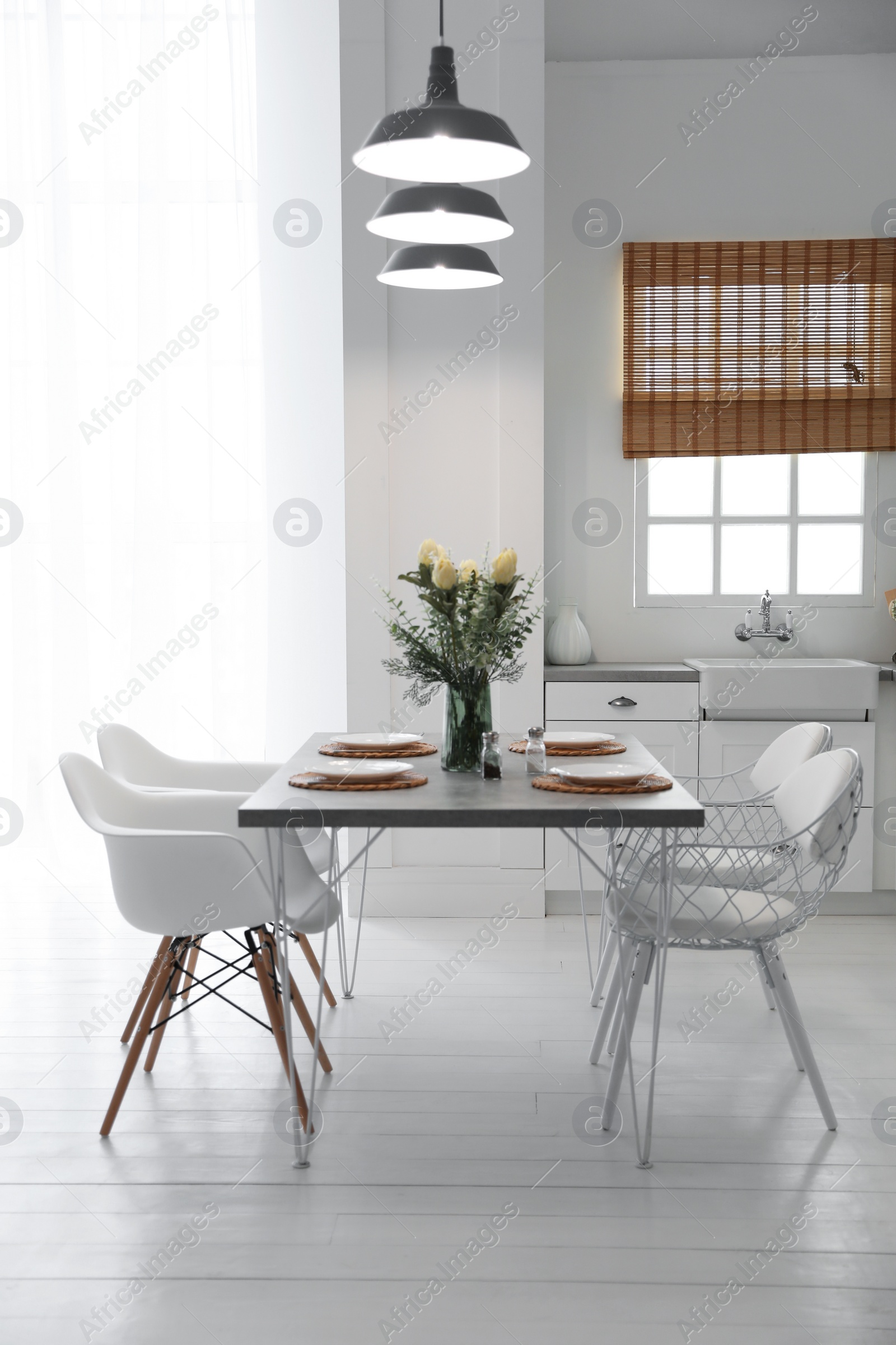 Photo of Beautiful dining room interior with new stylish furniture