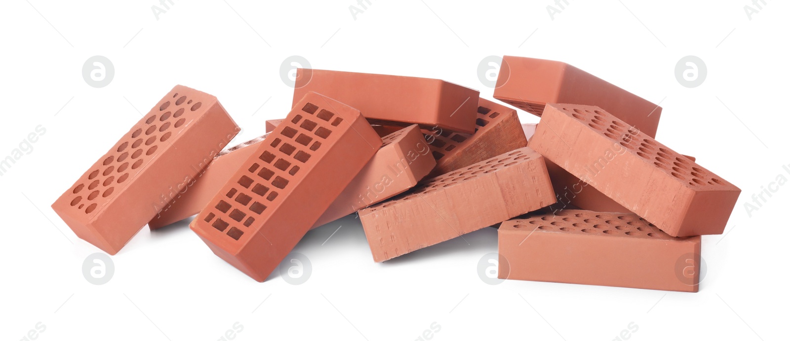 Photo of Pile of red bricks on white background. Building material