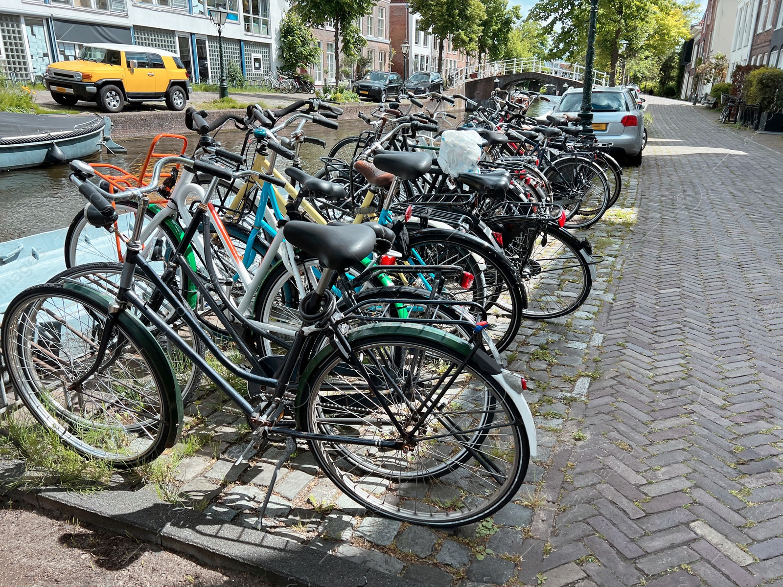 Photo of Parking with different bicycles on city street