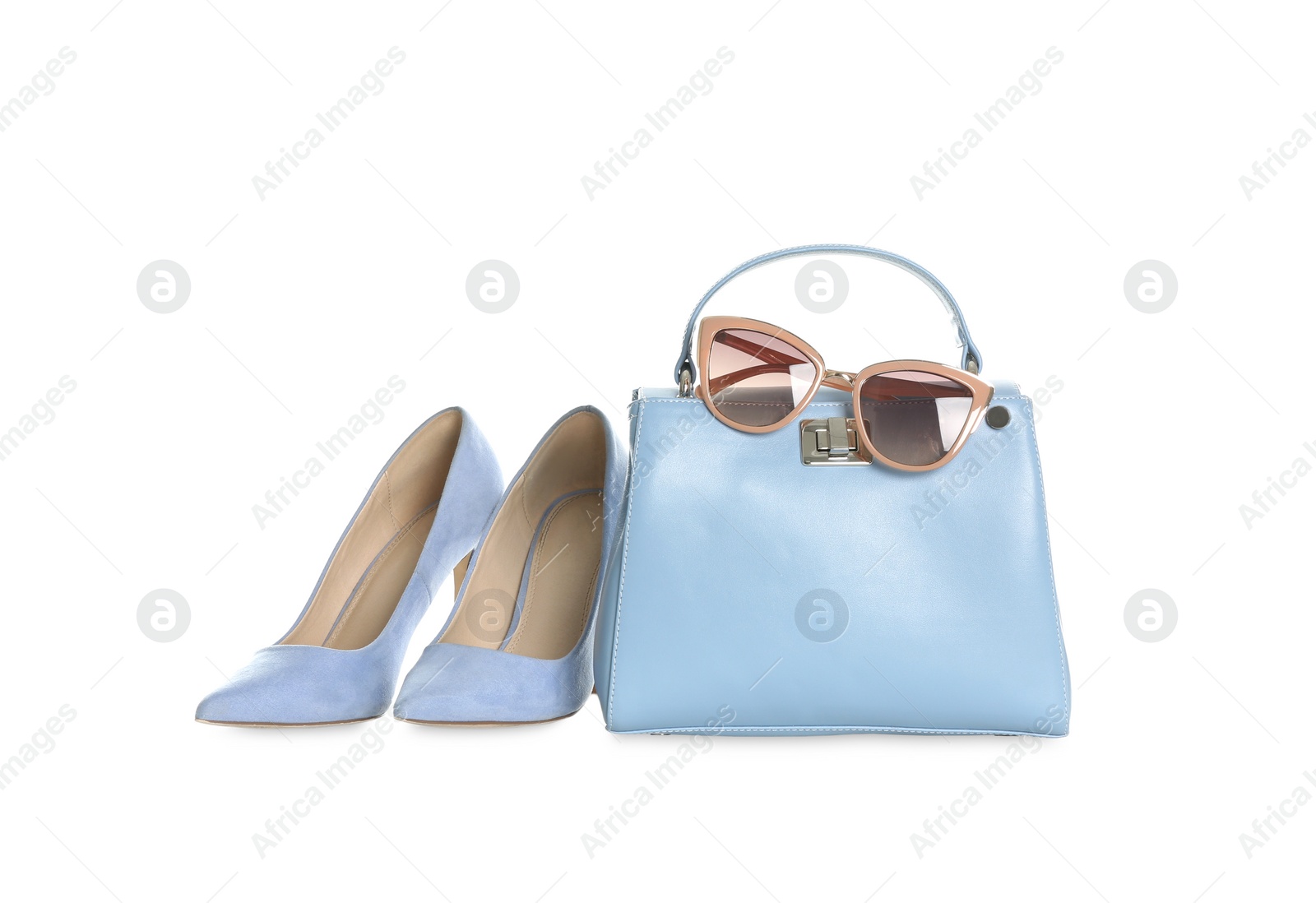 Photo of Stylish blue woman's bag, shoes and sunglasses isolated on white