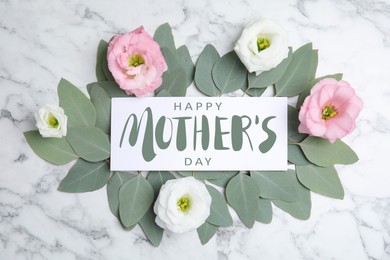 Image of Happy Mother's Day greeting card, beautiful eustoma flowers and eucalyptus leaves on white marble background, flat lay