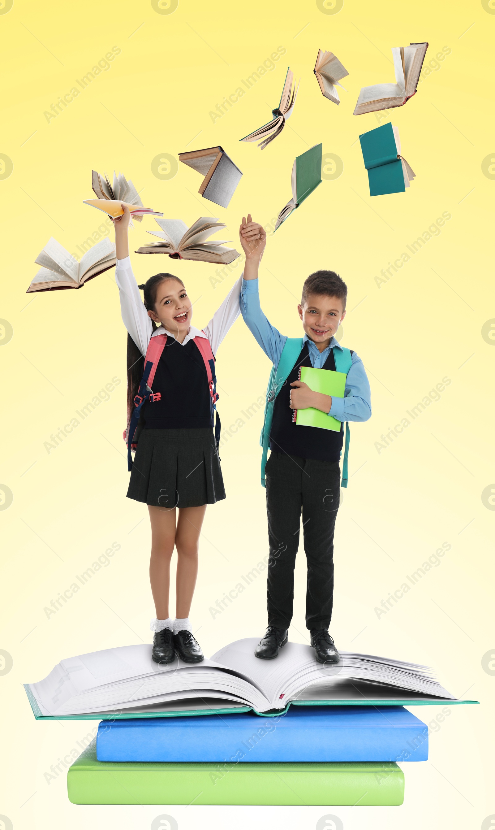 Image of Happy school kids on stack of books on yellow background. Way to knowledge