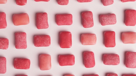 Photo of Sweet chewing gums on white background, top view