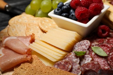 Photo of Snack set with delicious Parmesan cheese on table, closeup