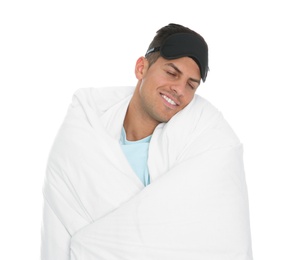 Man in mask wrapped with blanket sleeping on white background