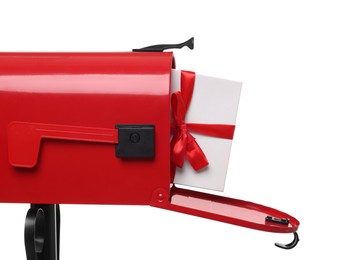 Red mailbox with Christmas gift isolated on white. Sending present by mail