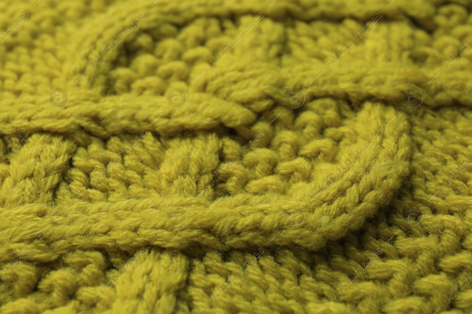 Photo of Knitted fabric with beautiful pattern as background, closeup