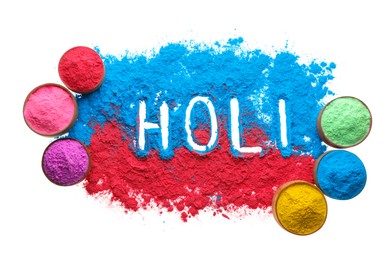 Colorful powders with word Holi on white background, top view
