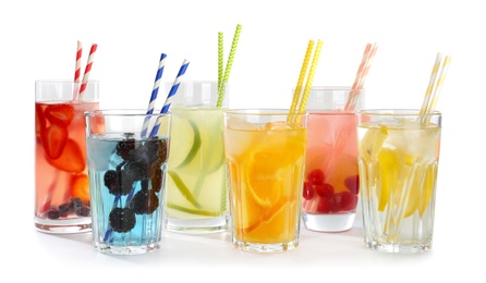 Photo of Glasses with tasty lemonades on white background