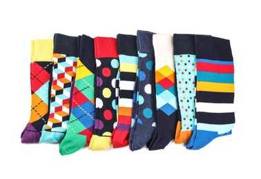 Colorful socks on white background, top view