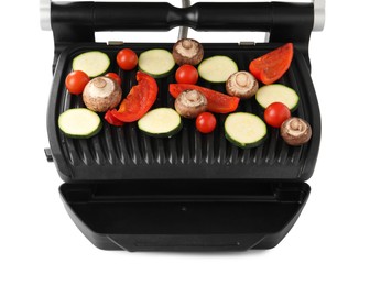 Photo of Electric grill with tomatoes, zucchini, bell pepper and mushrooms isolated on white