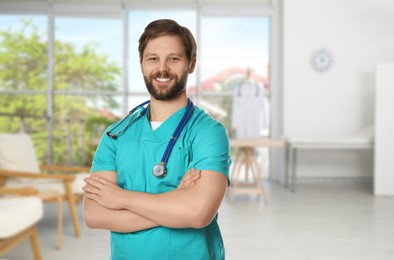 Nurse with stethoscope in uniform at hospital