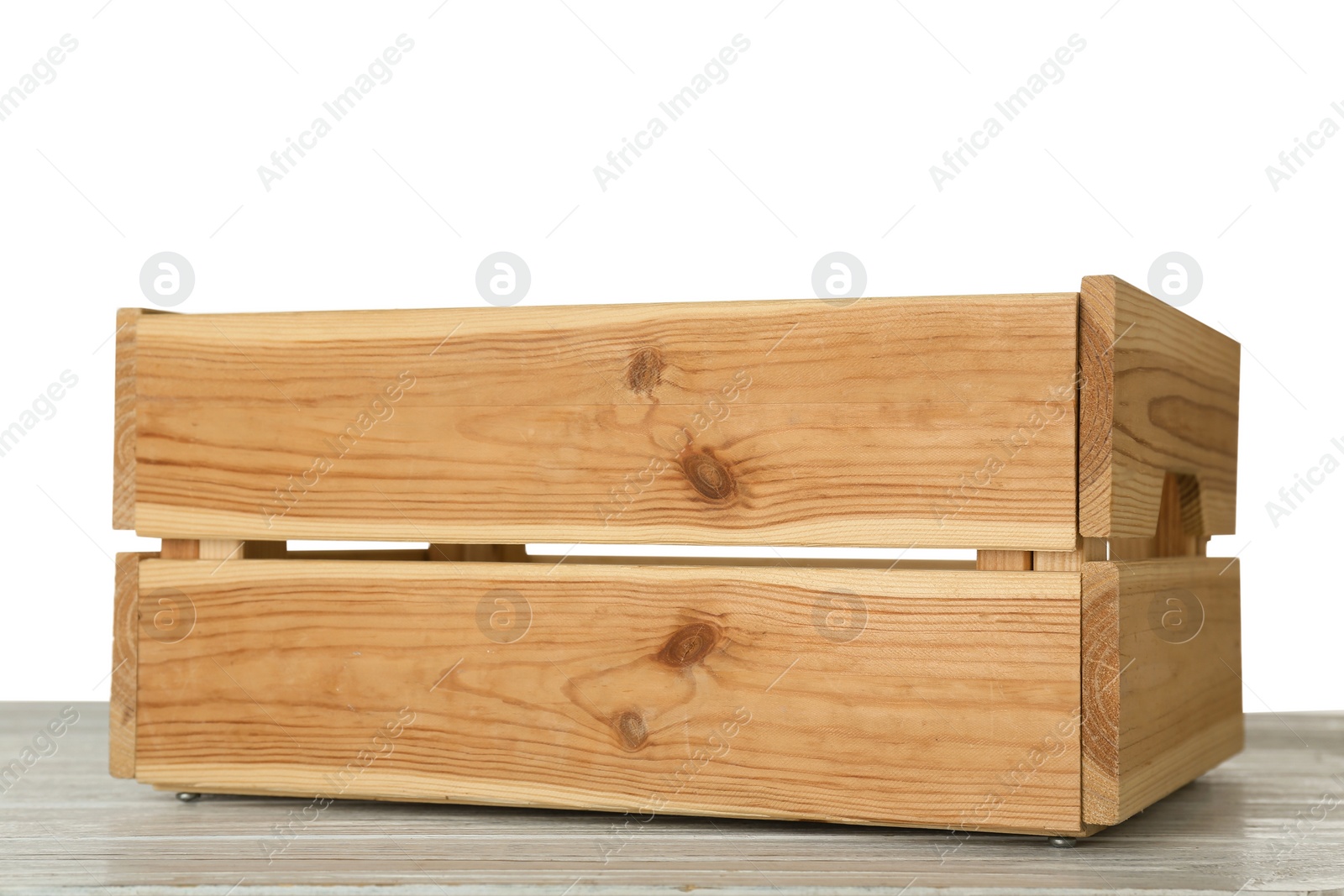 Photo of Empty rustic wooden crate on table against white background