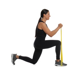 Photo of Woman doing lunges with fitness elastic band on white background