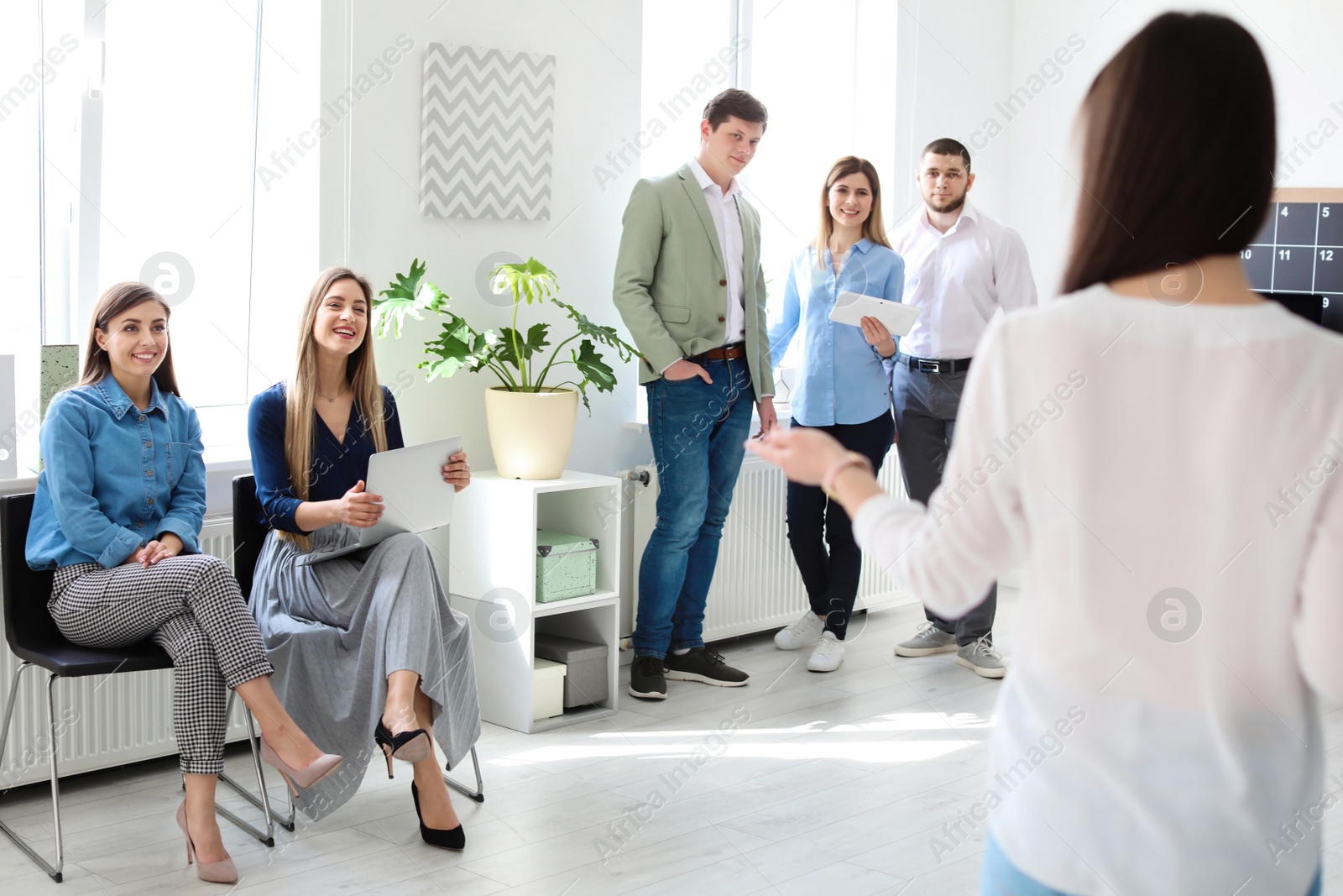 Photo of Young people having business training in office