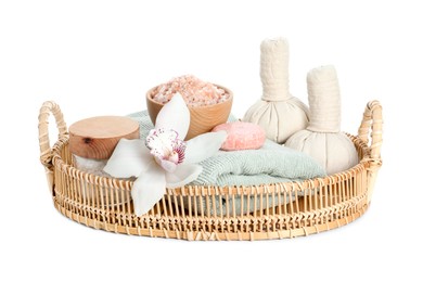 Photo of Spa composition. Towel, herbal massage bags, sea salt, soap and beautiful flower on white background