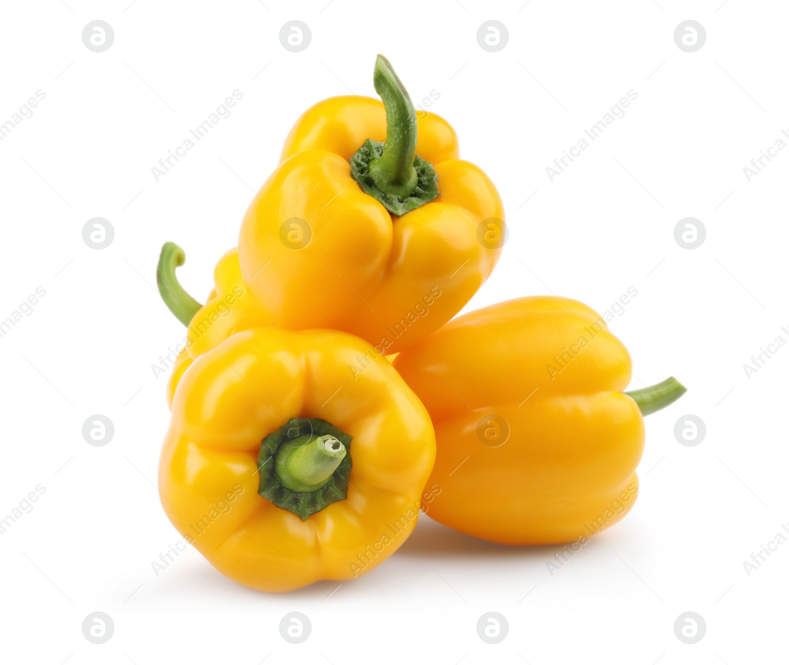 Photo of Ripe yellow bell peppers isolated on white