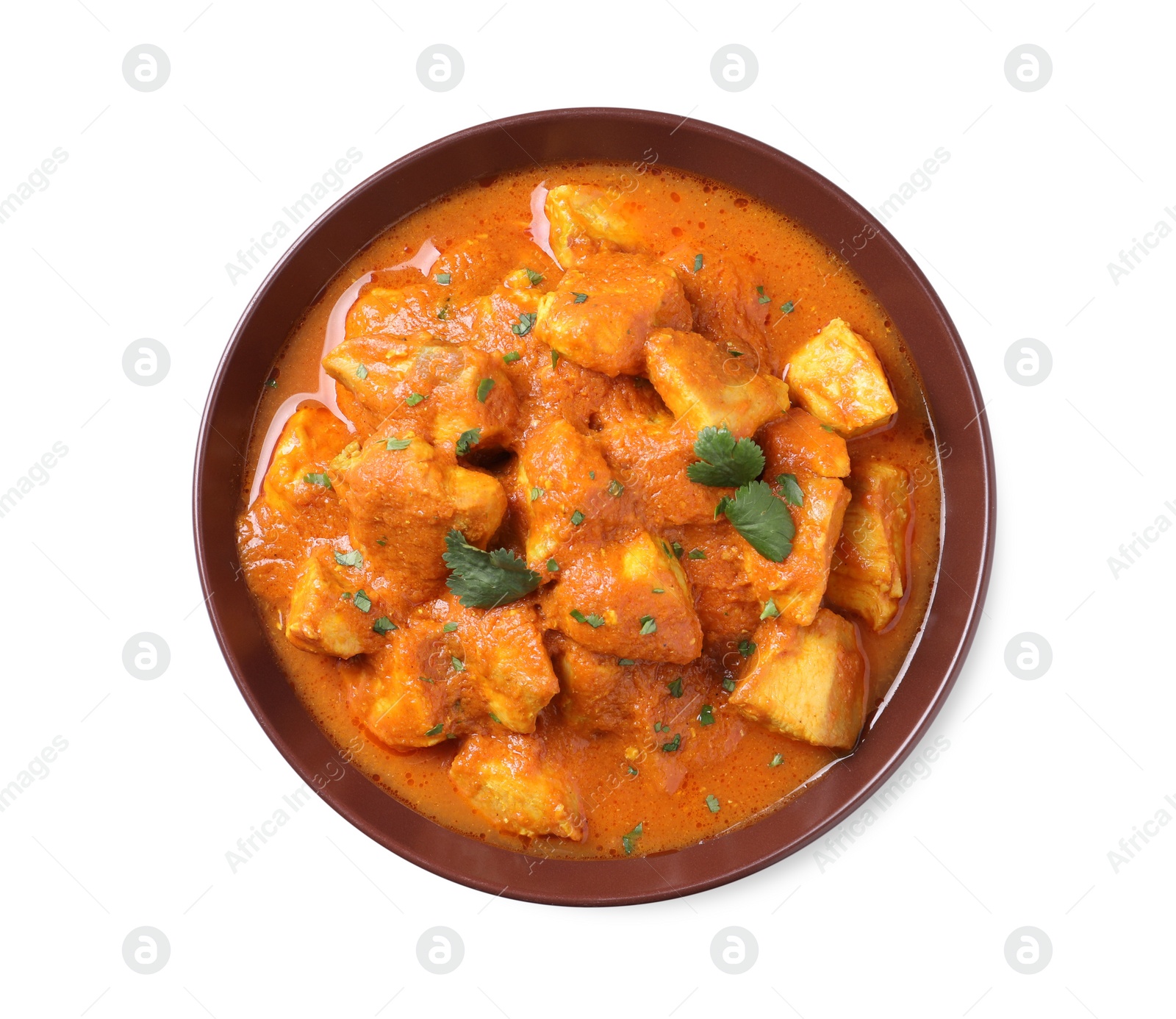 Photo of Bowl of delicious chicken curry on white background, top view