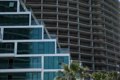 Modern and unfinished buildings outdoors. Construction site