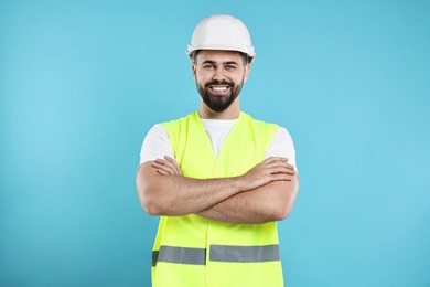 Engineer in hard hat on light blue background