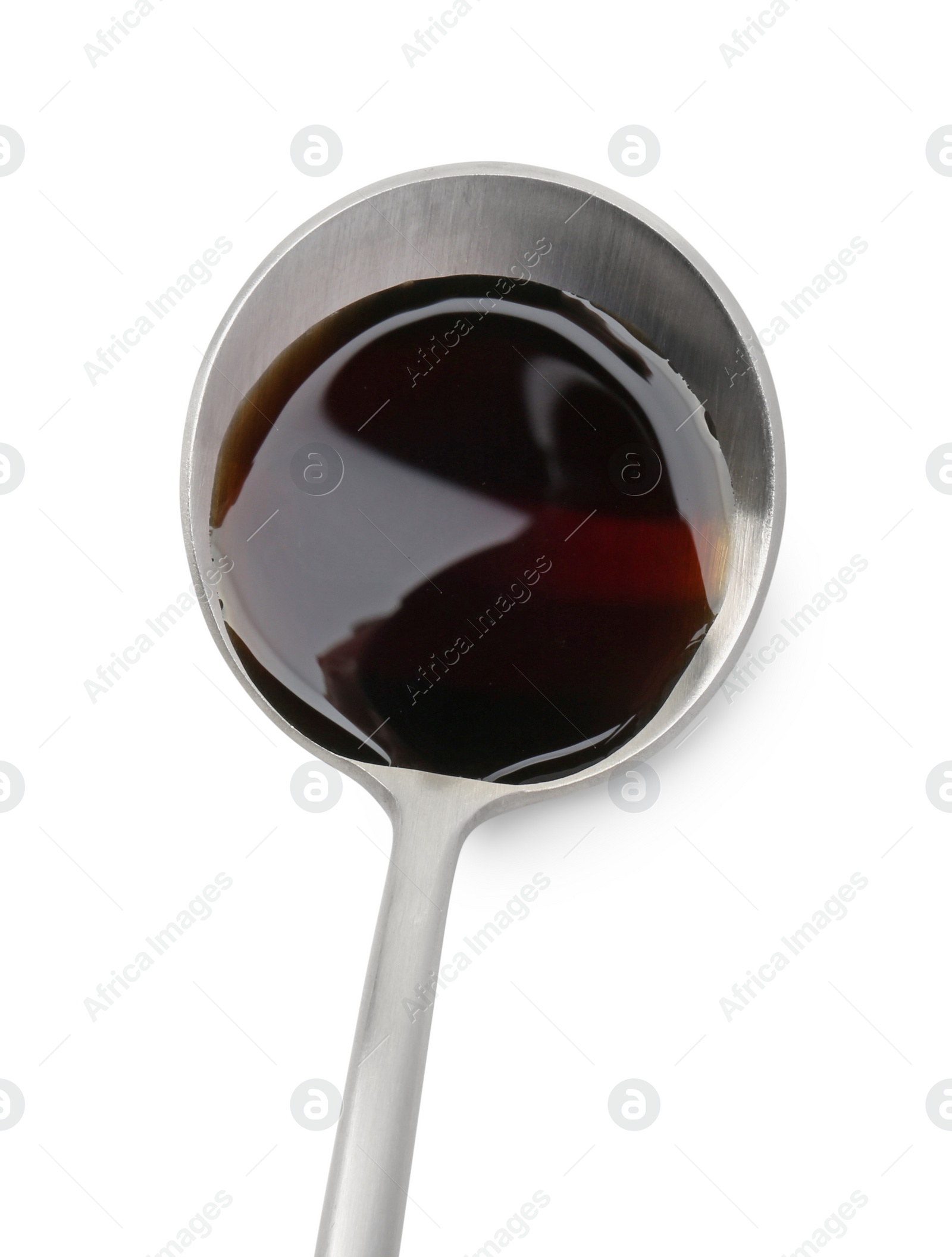 Photo of Tasty soy sauce in spoon isolated on white, top view