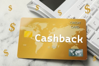 Image of Cashback credit card and calculator on white marble table, closeup