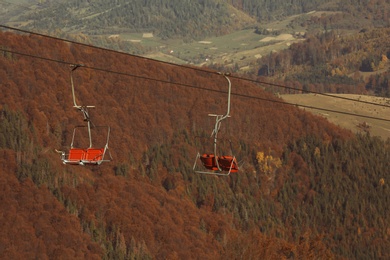 Chairlift with comfortable seats at mountain resort