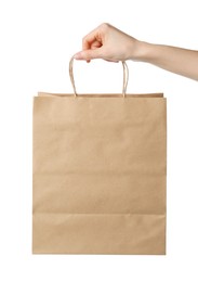 Woman holding kraft paper bag on white background, closeup. Mockup for design