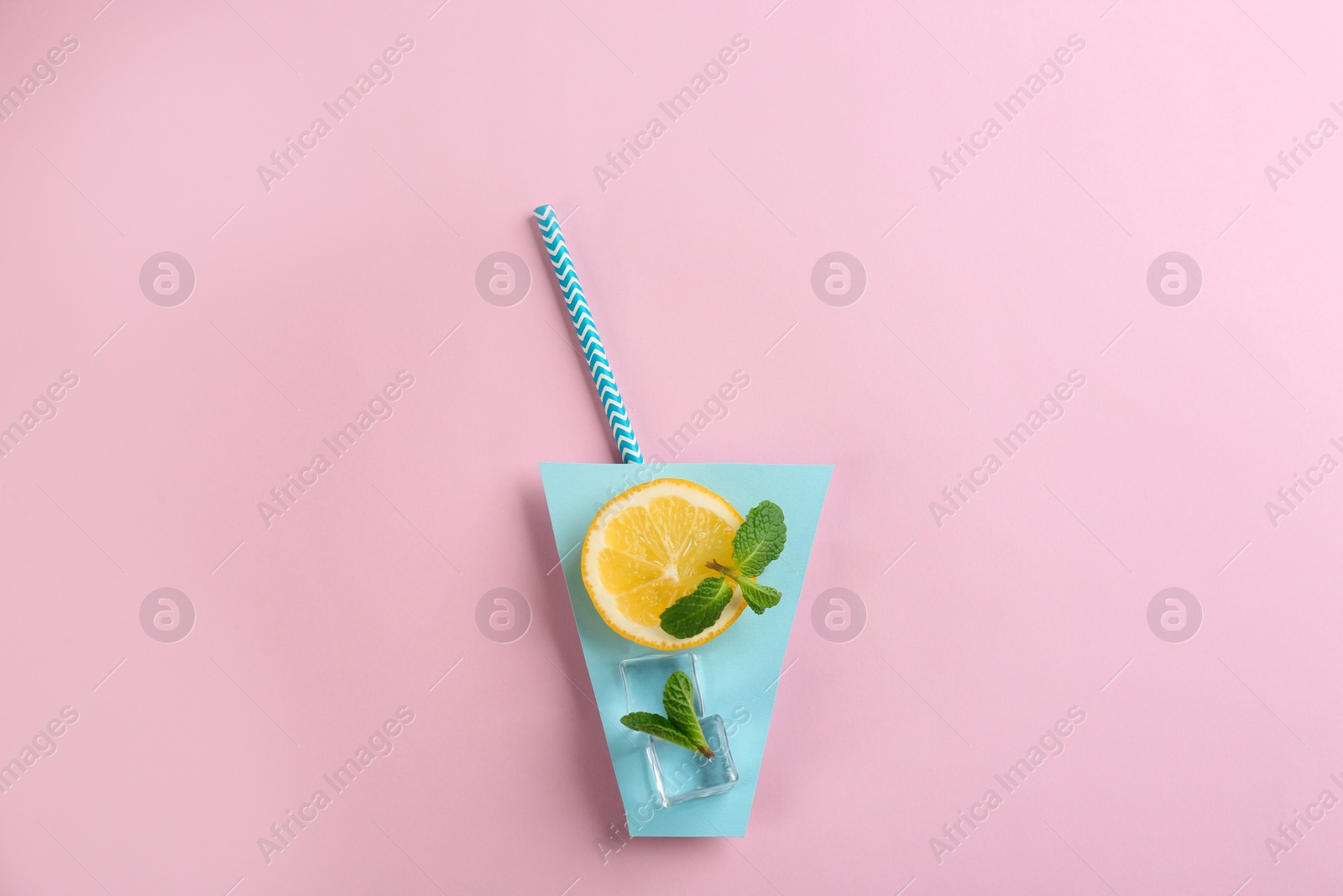 Photo of Creative lemonade layout with lemon slice, mint and ice cubes on pink background, top view