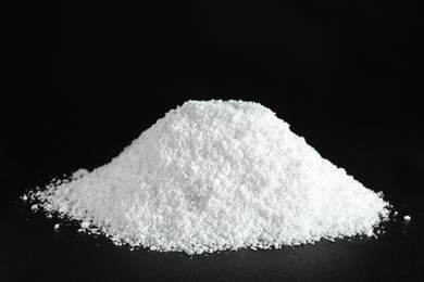 Photo of Heap of white snow on black background