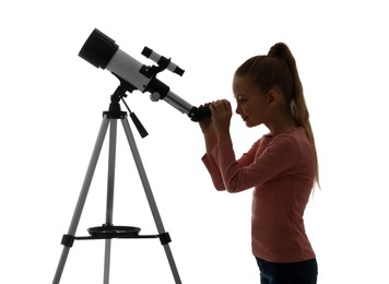 Happy little girl looking at stars through telescope on white background