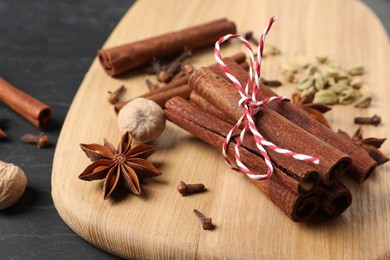 Cinnamon sticks and other spices on table, closeup