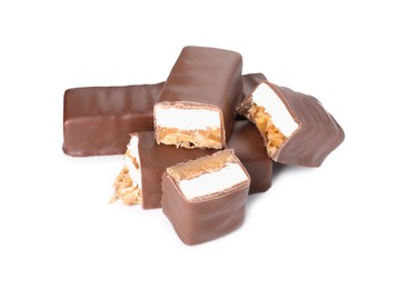 Photo of Pieces of tasty chocolate bars with nougat and nuts on white background