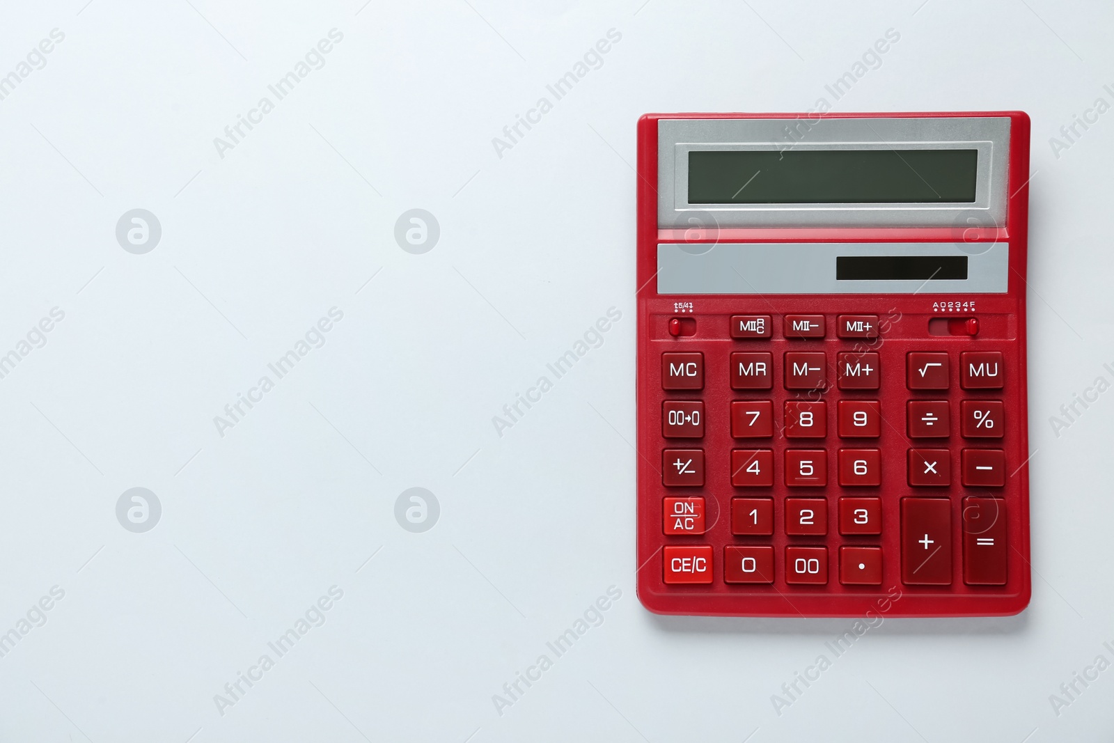 Photo of Red calculator on light background, top view. Space for text