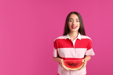 Photo of Beautiful young woman posing with watermelon on color background